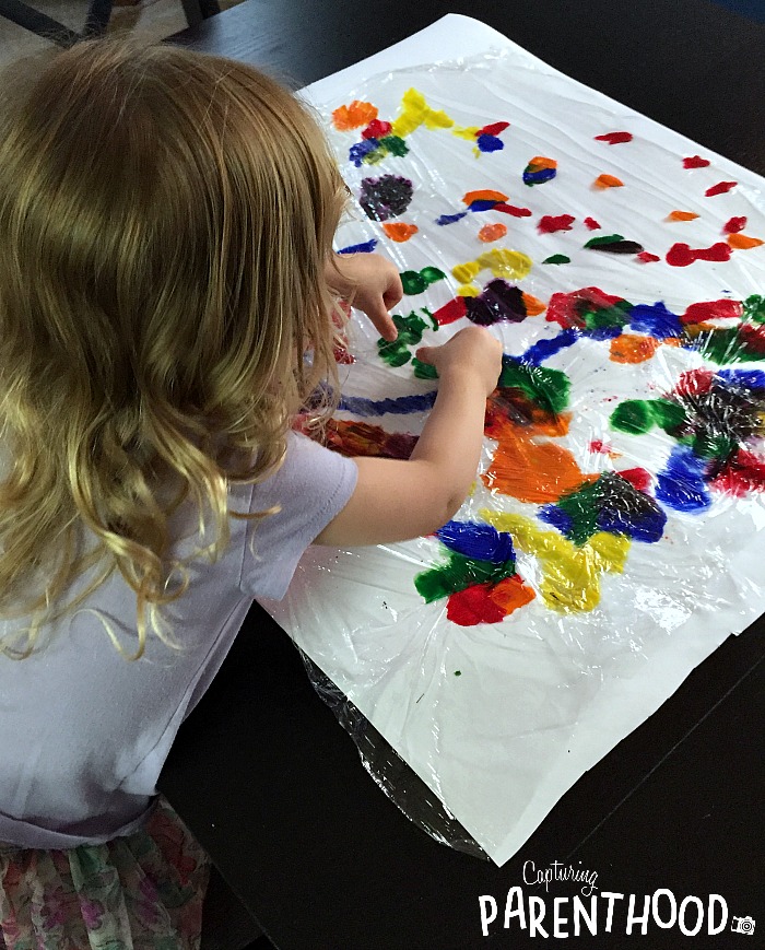 Plastic Wrap Painting Process Art Capturing Parenthood